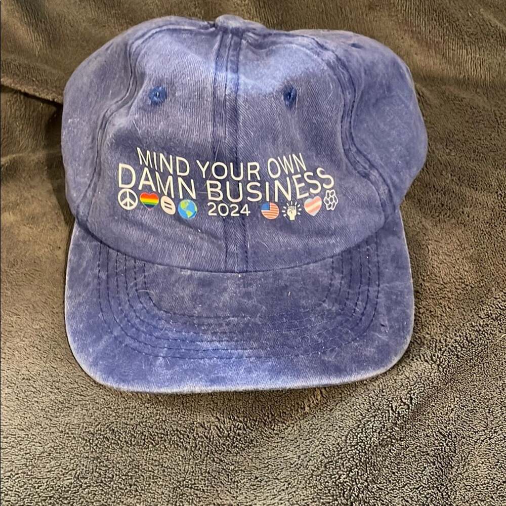 Blue baseball cap with adjustable strap "Mind Your Own Damn Business" NWOT